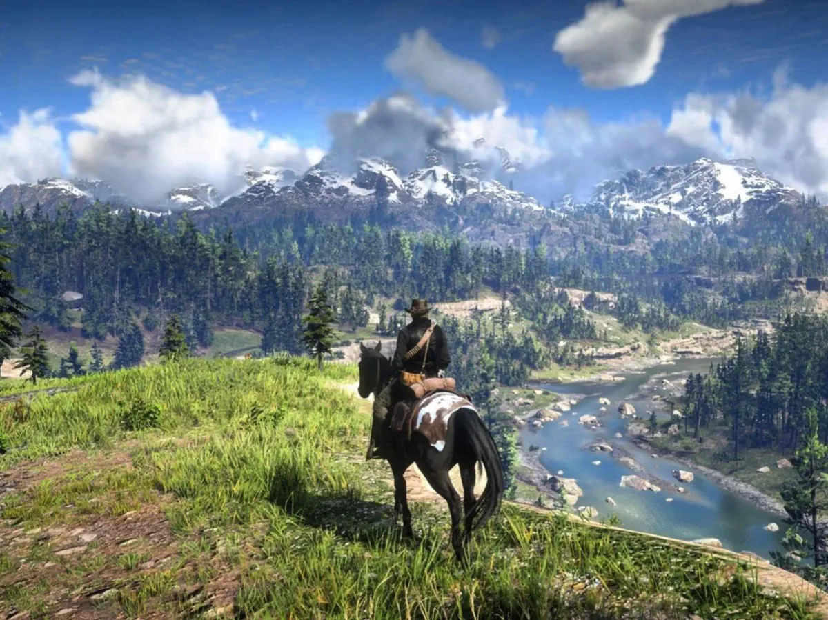Rider on horseback overlooking a river valley in an open-world game
